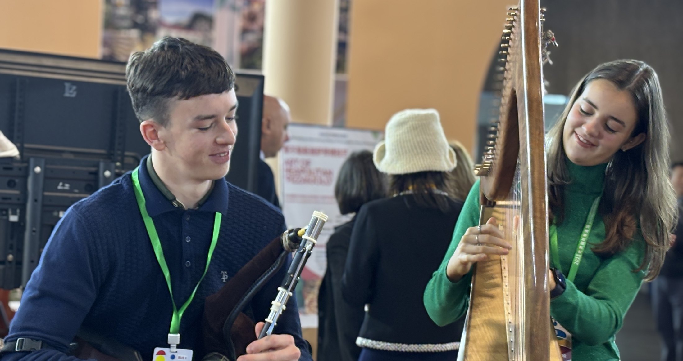 Irish harp and Uilleann pipes musicians performing together during a Beijing cultural exchange programme