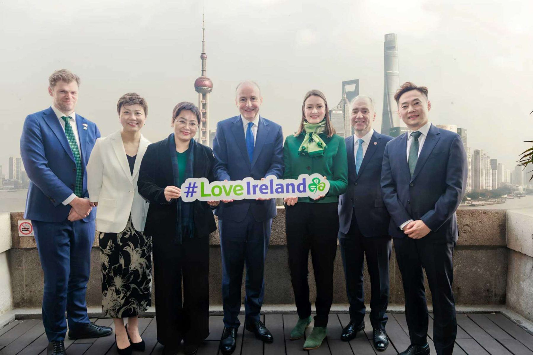 Irish tourism delegation in China holding a Love Ireland sign